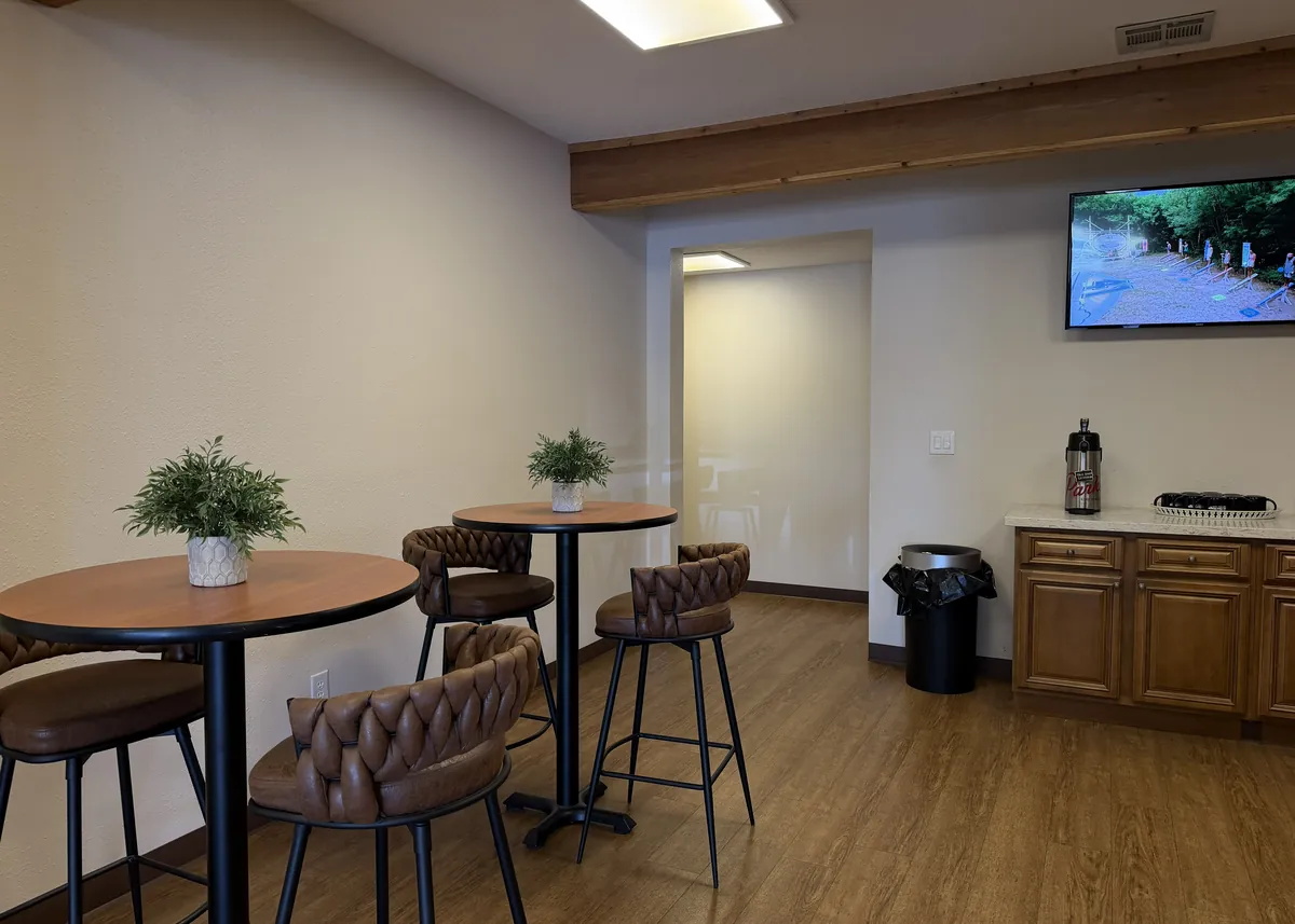 Café lounge with bar-height tables at Heritage Office Suites Round Rock